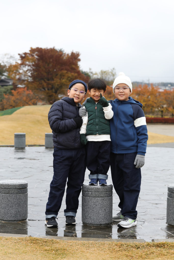 028 Children climbing on stone posts in Yamanakako Park